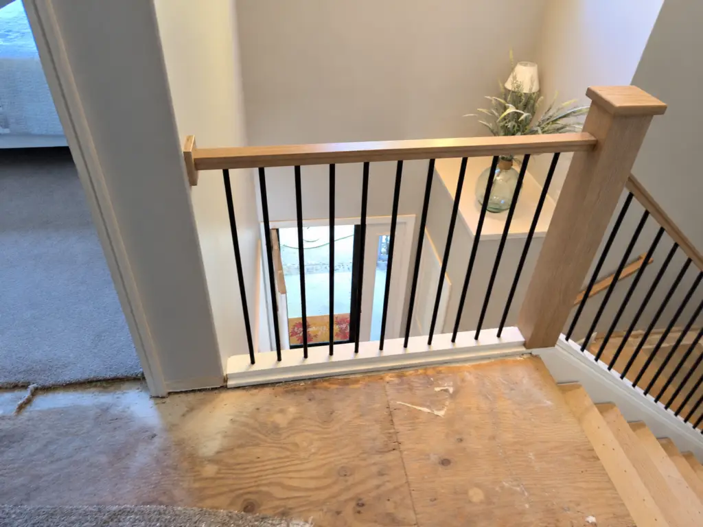 Stair Railing Replacement in Grand Forks — black metal spindles